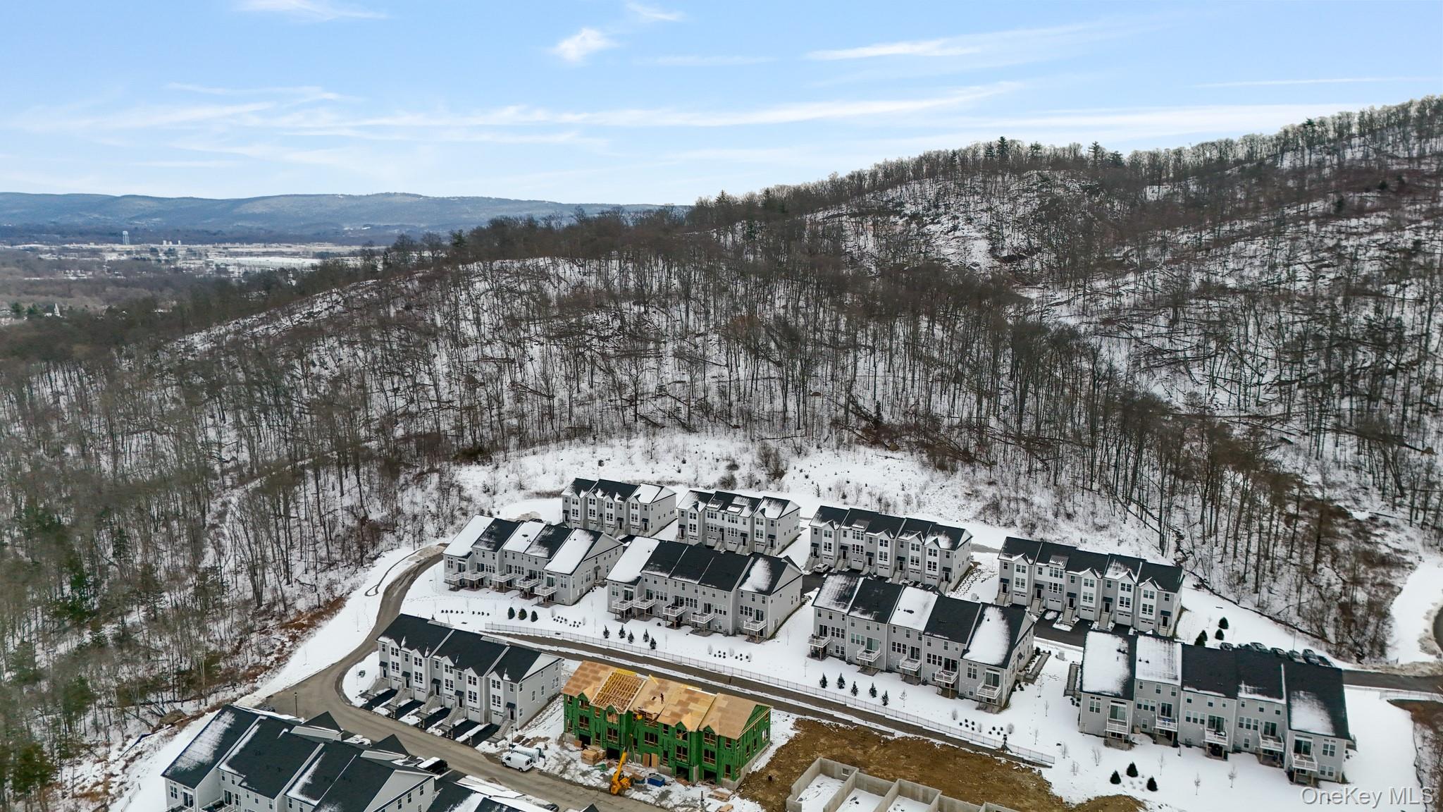 4034 Chestnut Rdg Road, Unit 62 Fishkill, NY 12524 - Photo 5 of 31 Snowy aerial view with a mountain view