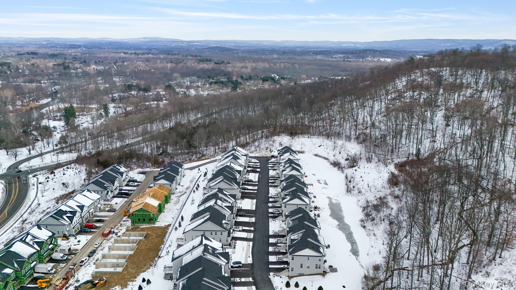 4034 Chestnut Rdg Road, Unit 62 Fishkill, NY 12524 - Photo 6 of 31 Snowy aerial view featuring a mountain view