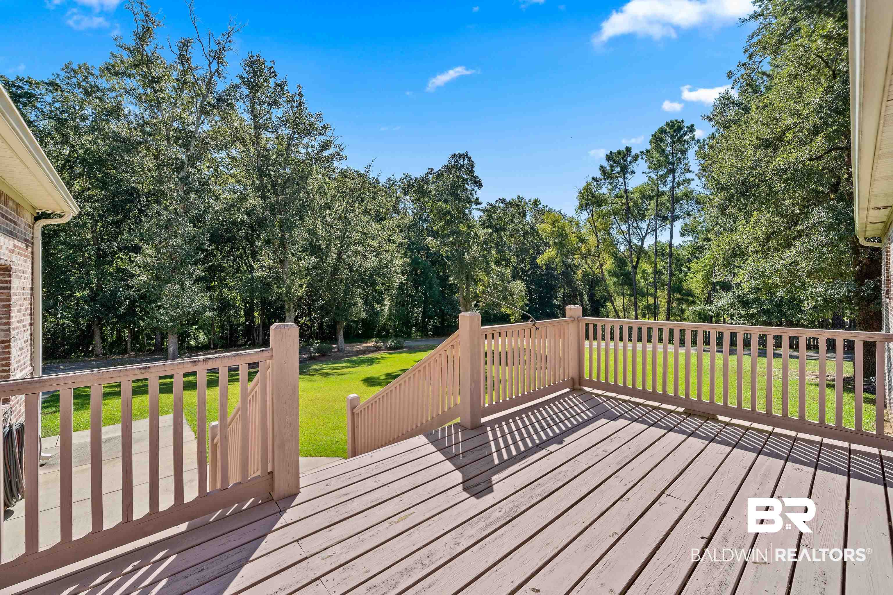 29530 St John Street Daphne, AL 36526 - Photo 24 of 38 Wooden deck with a lawn