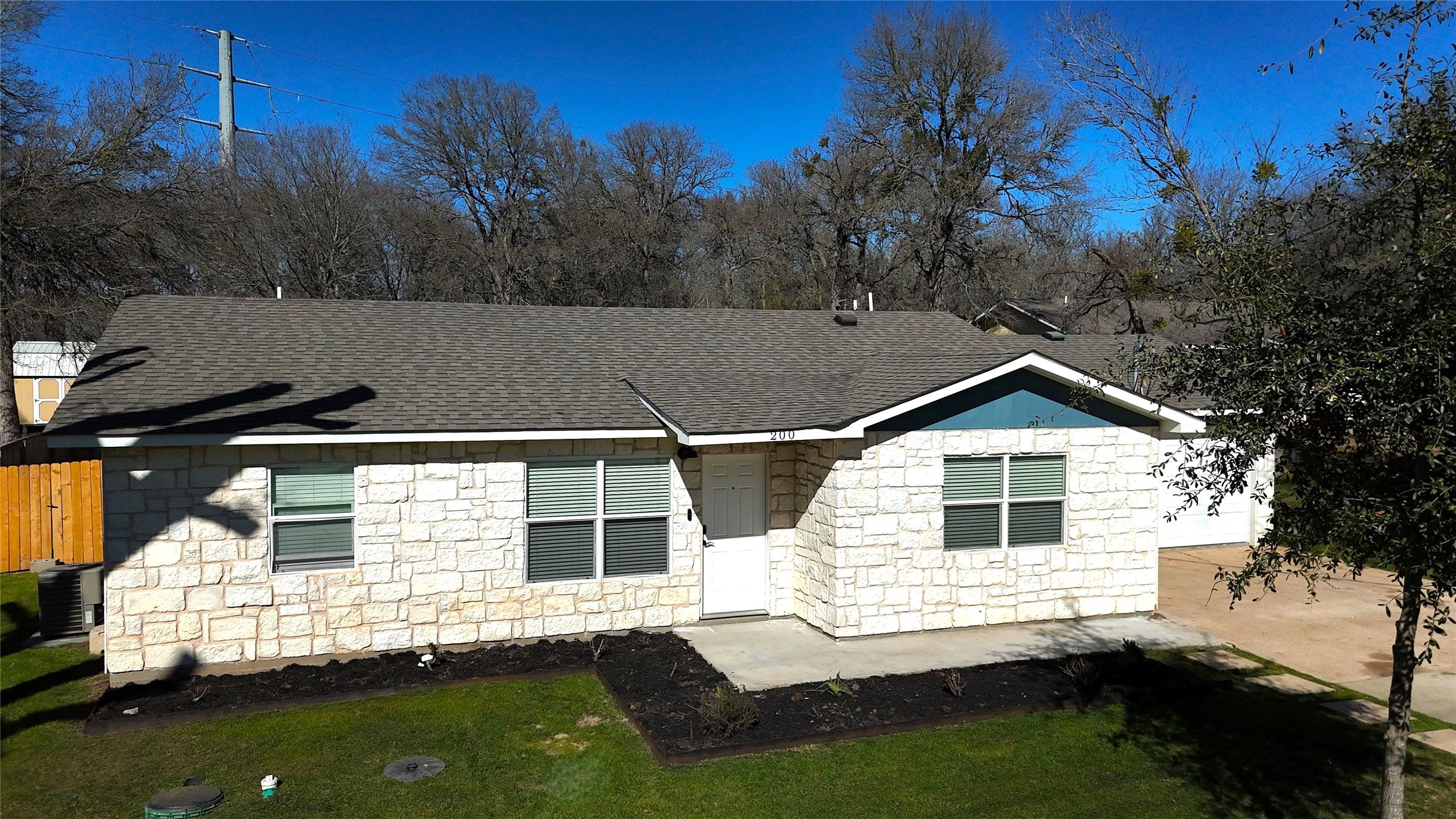 a view of house with backyard