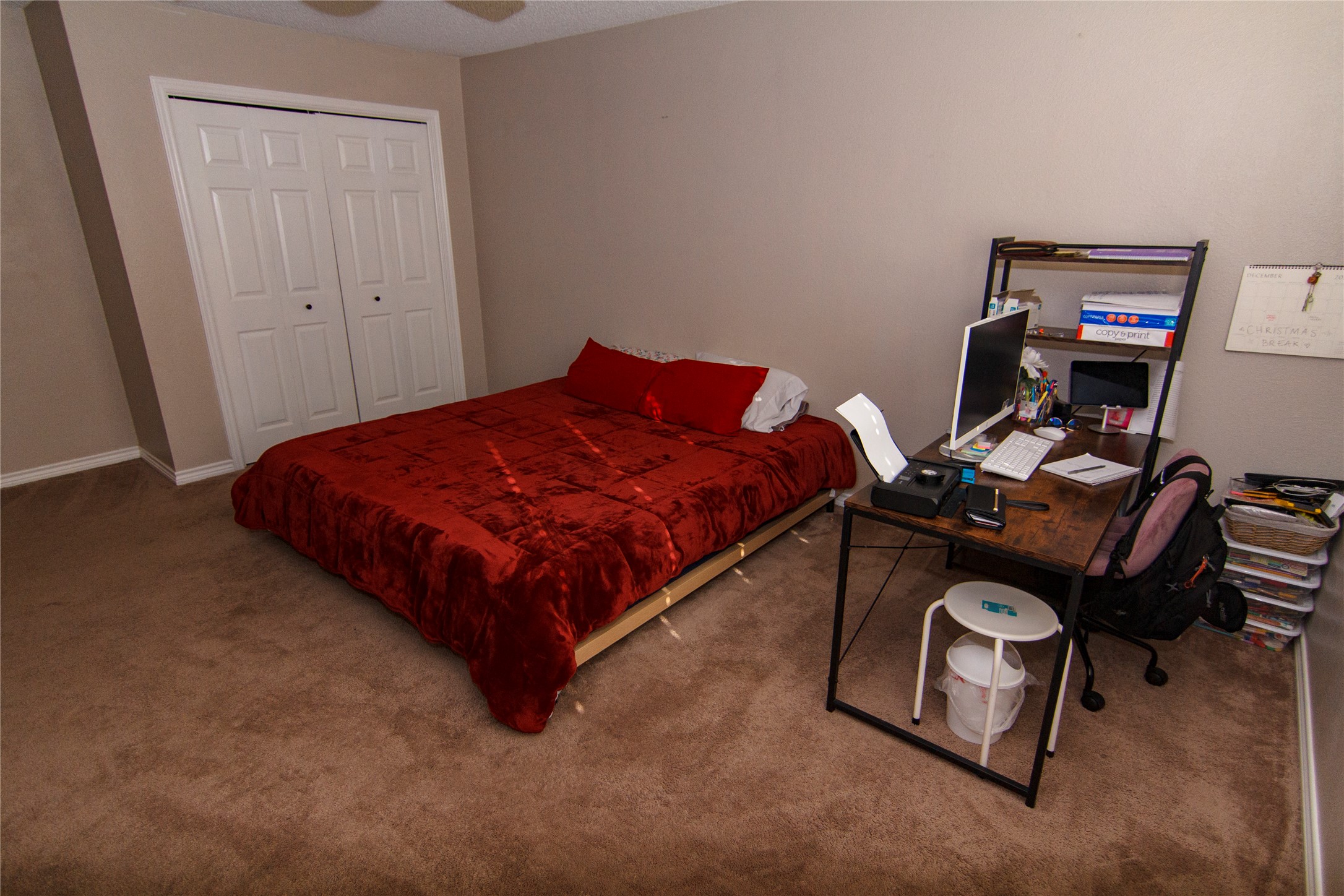 200 Keanahalululu Lane, Unit R Bastrop, TX 78602 - Photo 13 of 32 a bedroom with a bed and a desk