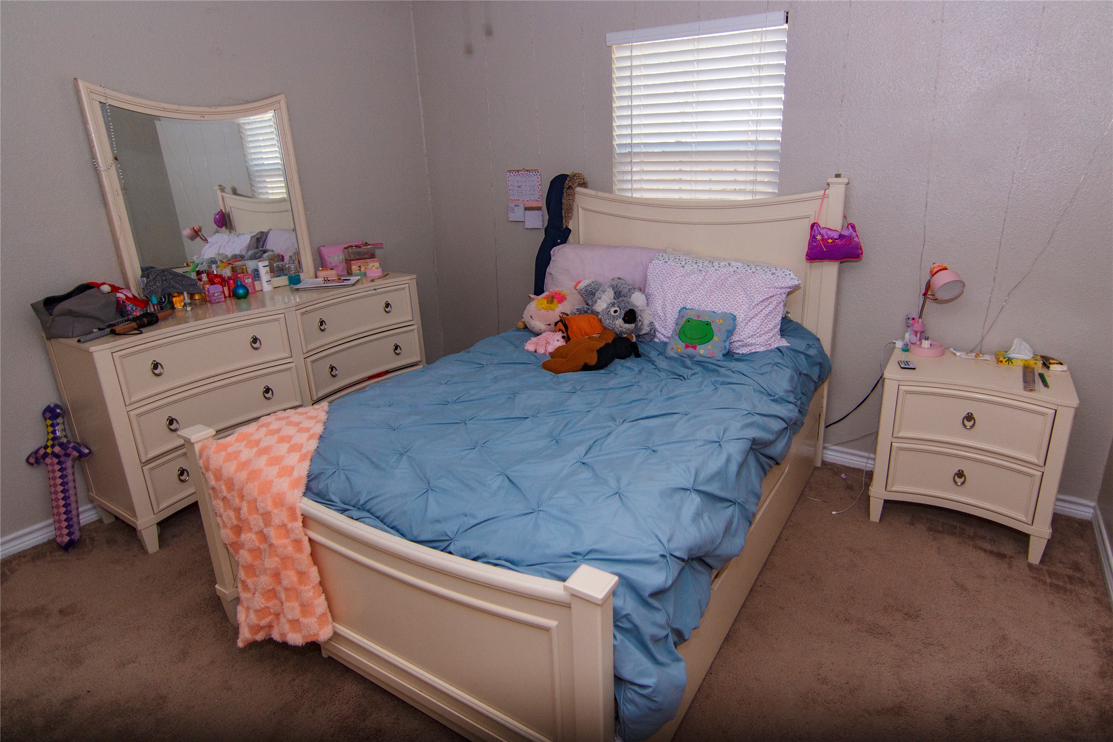 200 Keanahalululu Lane, Unit R Bastrop, TX 78602 - Photo 14 of 32 a bedroom with a bed and a dresser