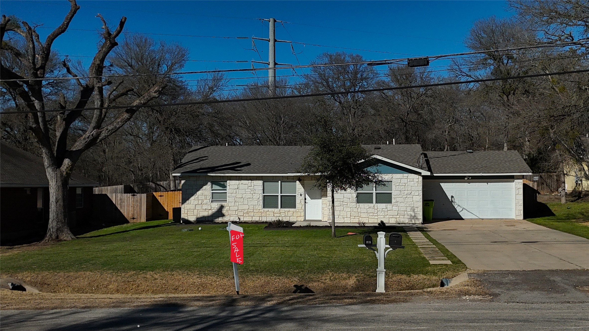 200 Keanahalululu Lane, Unit R Bastrop, TX 78602 - Photo 2 of 32 a front view of a house with a yard