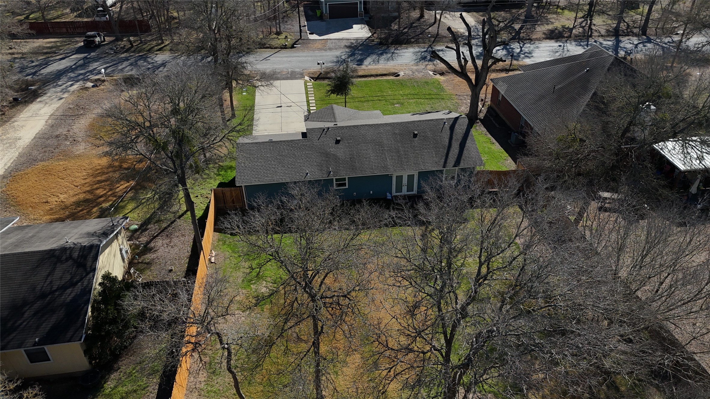 200 Keanahalululu Lane, Unit R Bastrop, TX 78602 - Photo 24 of 32 a view of a house with a yard
