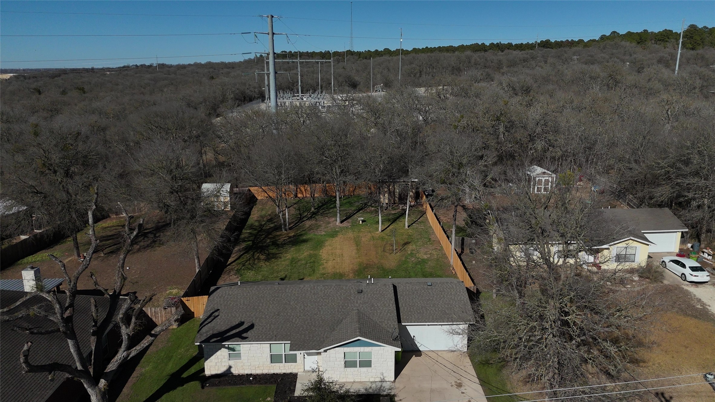 200 Keanahalululu Lane, Unit R Bastrop, TX 78602 - Photo 32 of 32 an aerial view of a house with a yard