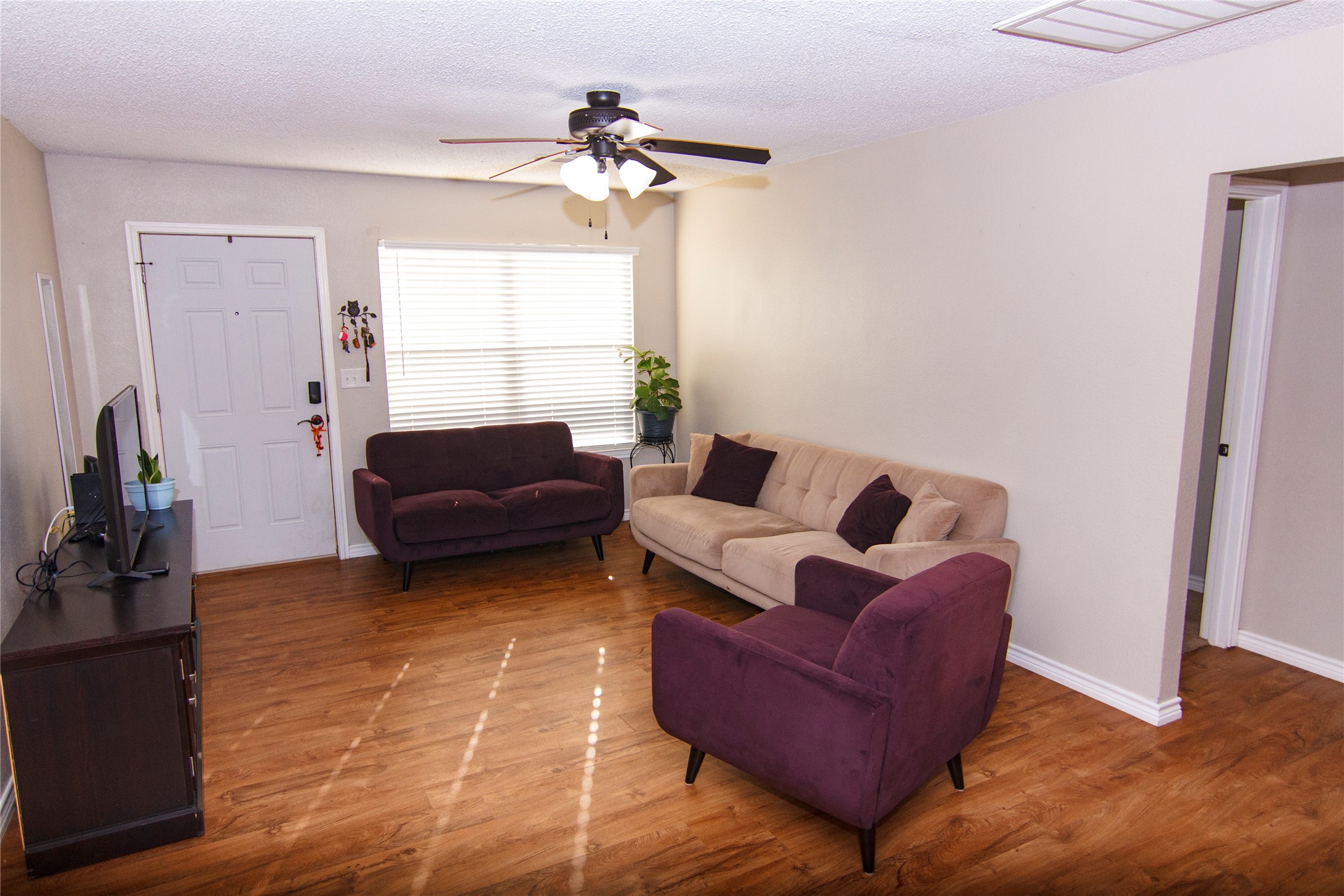 200 Keanahalululu Lane, Unit R Bastrop, TX 78602 - Photo 5 of 32 a living room with furniture and a window