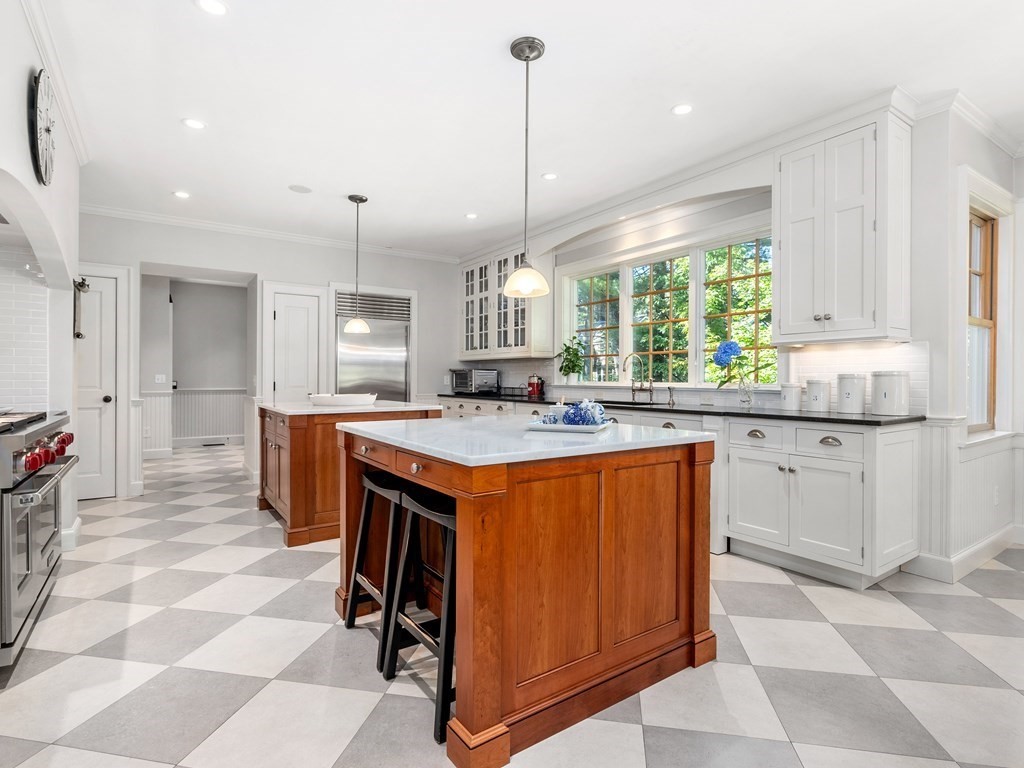 21 Hilltop Road Weston, MA 02493 - Photo 15 of 42 a kitchen with stainless steel appliances granite countertop a stove a sink and a refrigerator