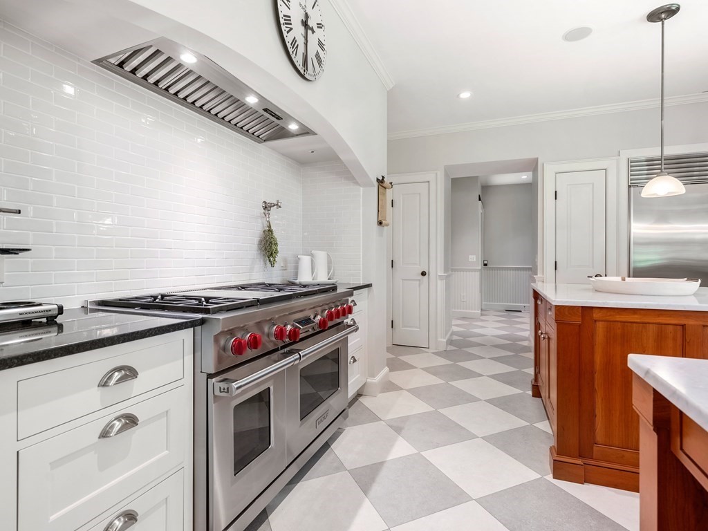 21 Hilltop Road Weston, MA 02493 - Photo 16 of 42 a kitchen with stainless steel appliances granite countertop a stove a sink and a refrigerator
