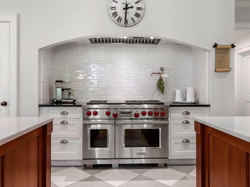 21 Hilltop Road Weston, MA 02493 - Photo 18 of 42 a white stove top oven sitting inside of a kitchen