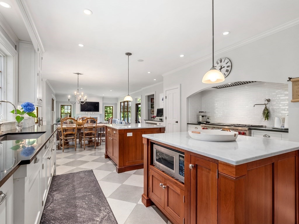 21 Hilltop Road Weston, MA 02493 - Photo 21 of 42 a kitchen with kitchen island a sink stove and center island