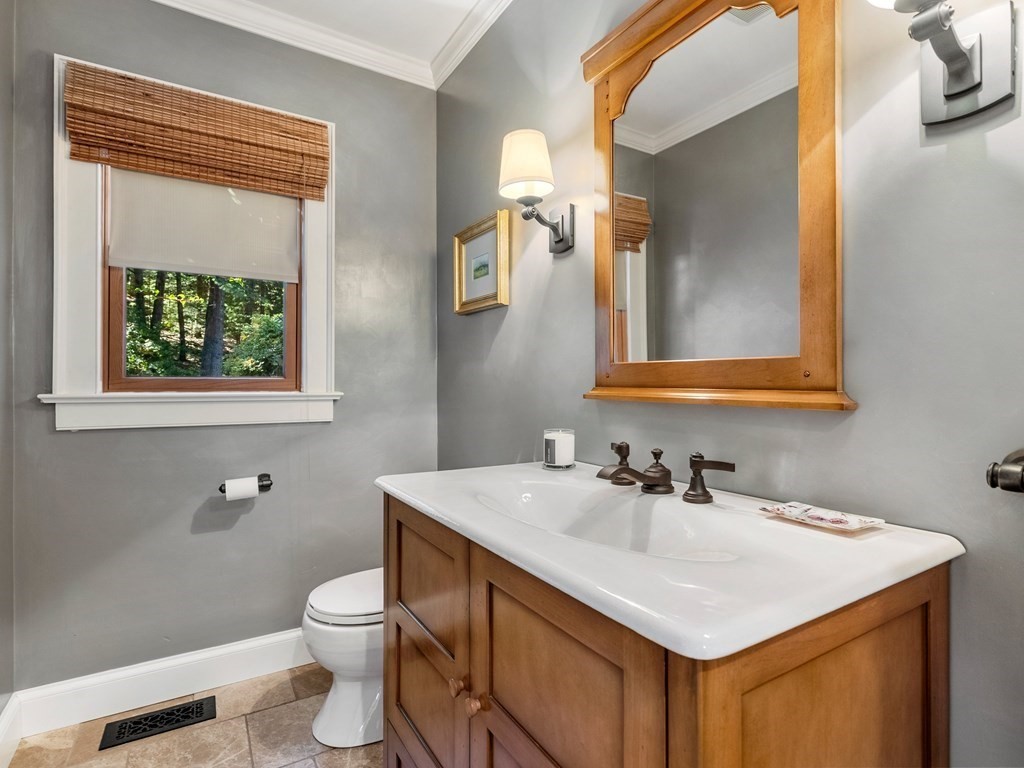 21 Hilltop Road Weston, MA 02493 - Photo 23 of 42 a bathroom with a sink vanity and a toilet