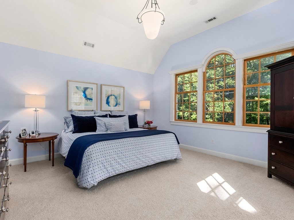 21 Hilltop Road Weston, MA 02493 - Photo 25 of 42 a spacious bedroom with a bed and window