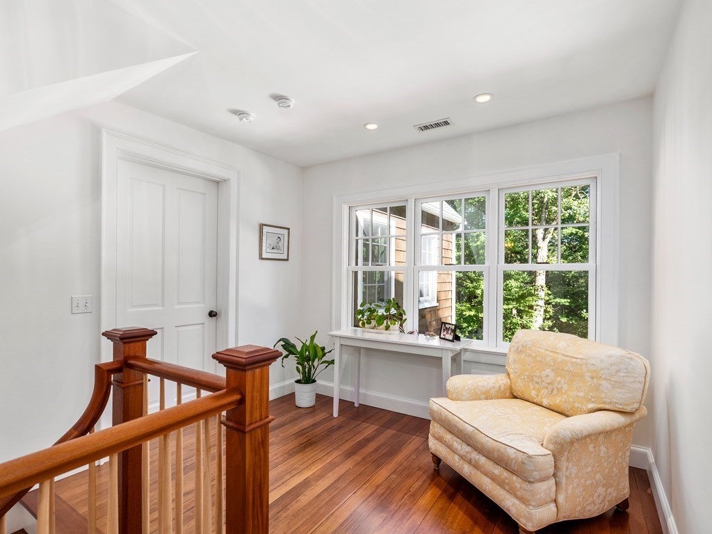 21 Hilltop Road Weston, MA 02493 - Photo 27 of 42 a living room with furniture and a large window