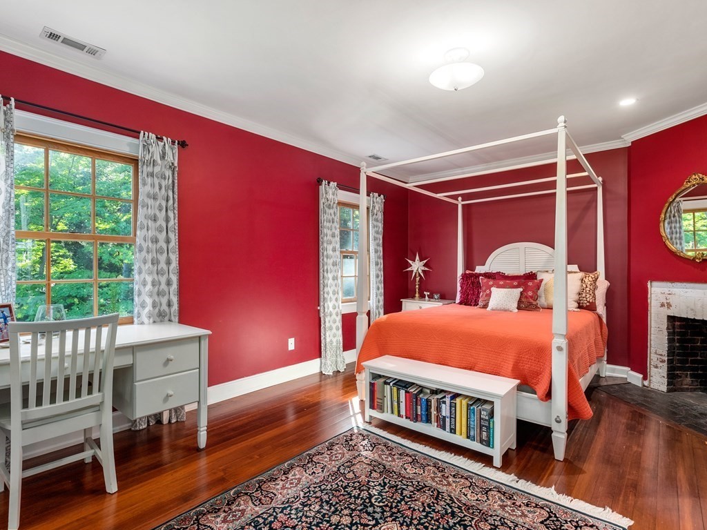21 Hilltop Road Weston, MA 02493 - Photo 29 of 42 a bedroom with a bed and a window