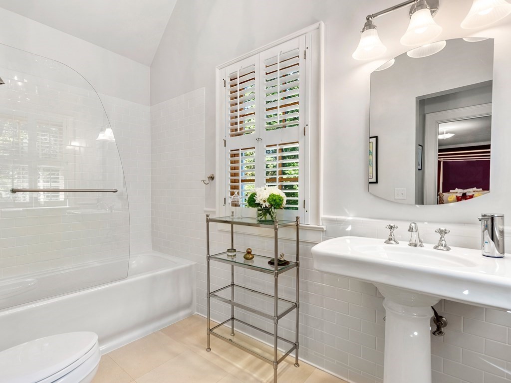 21 Hilltop Road Weston, MA 02493 - Photo 30 of 42 a bathroom with a bathtub shower sink and toilet