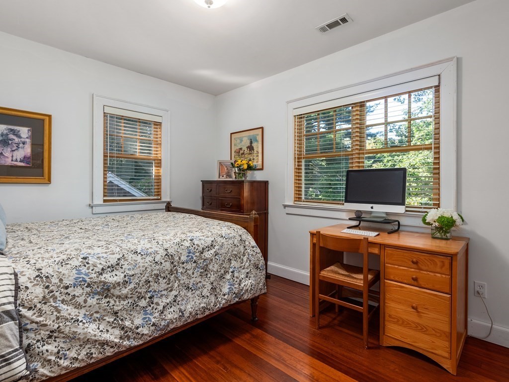 21 Hilltop Road Weston, MA 02493 - Photo 33 of 42 a bedroom with a bed and large windows