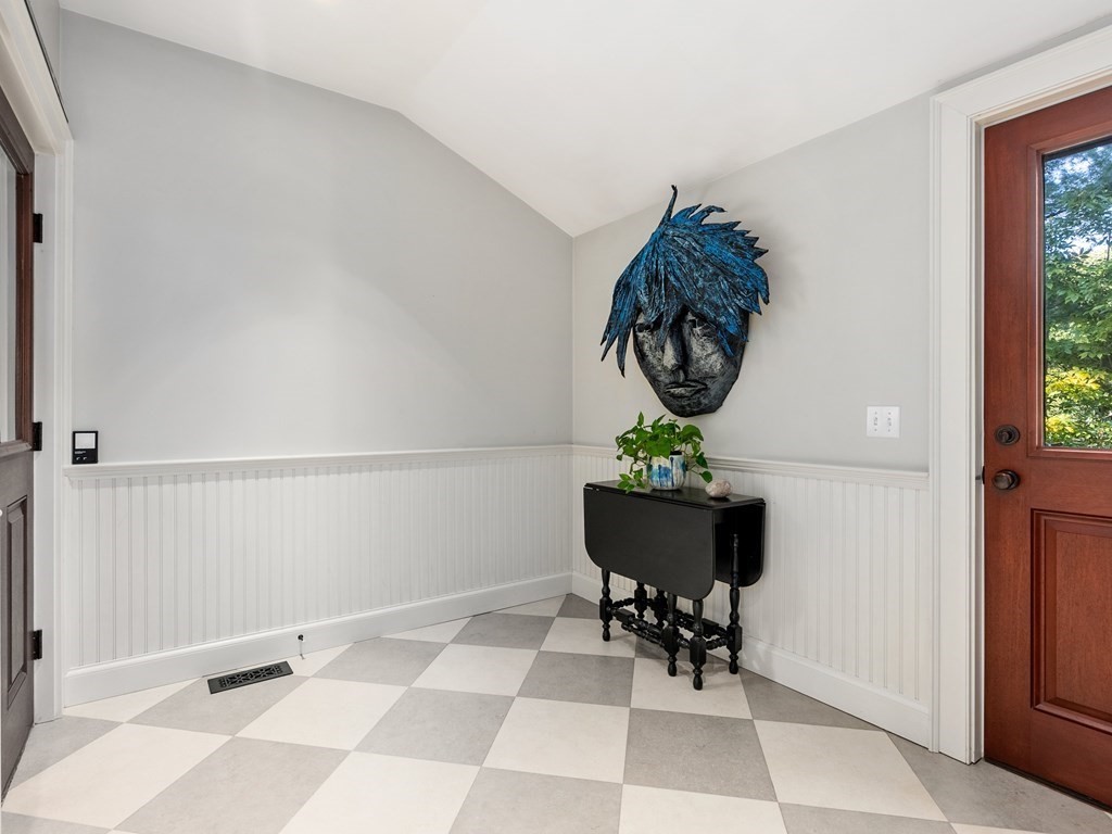 21 Hilltop Road Weston, MA 02493 - Photo 36 of 42 a living room with a table and a chair