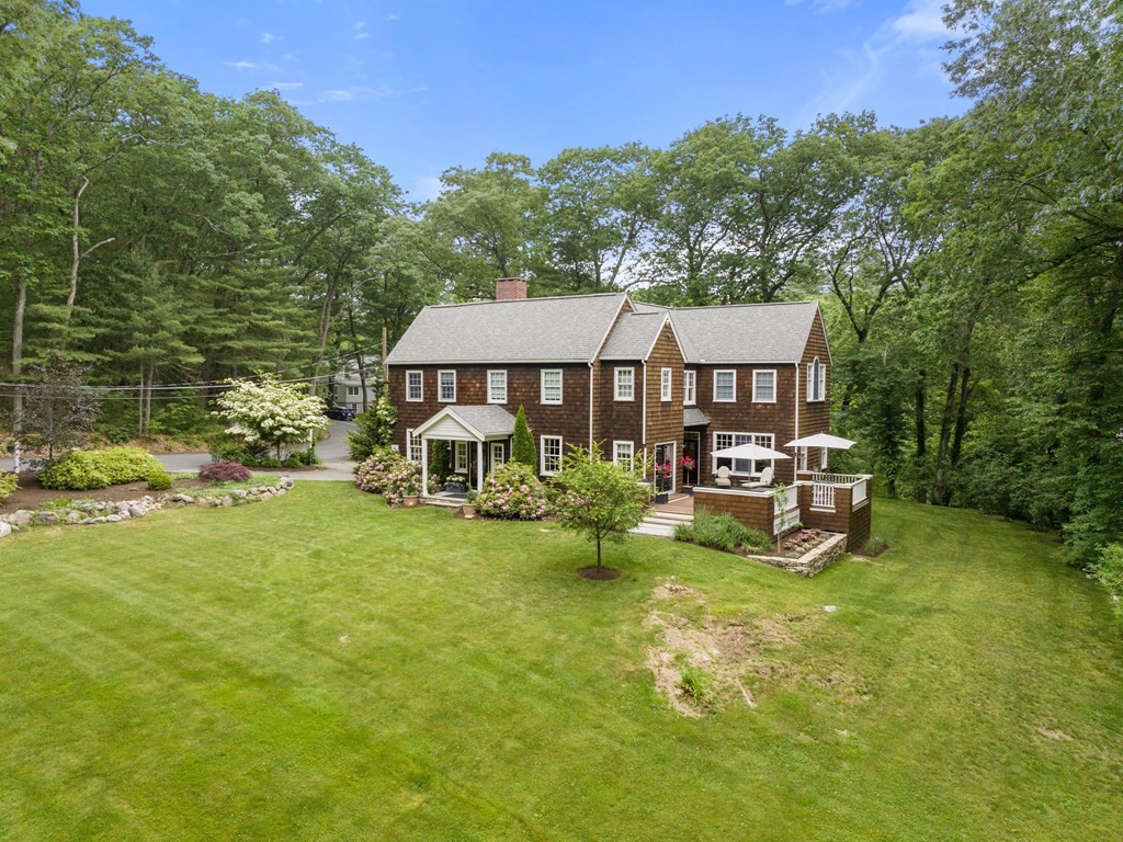 21 Hilltop Road Weston, MA 02493 - Photo 41 of 42 a view of a house with backyard porch and sitting area