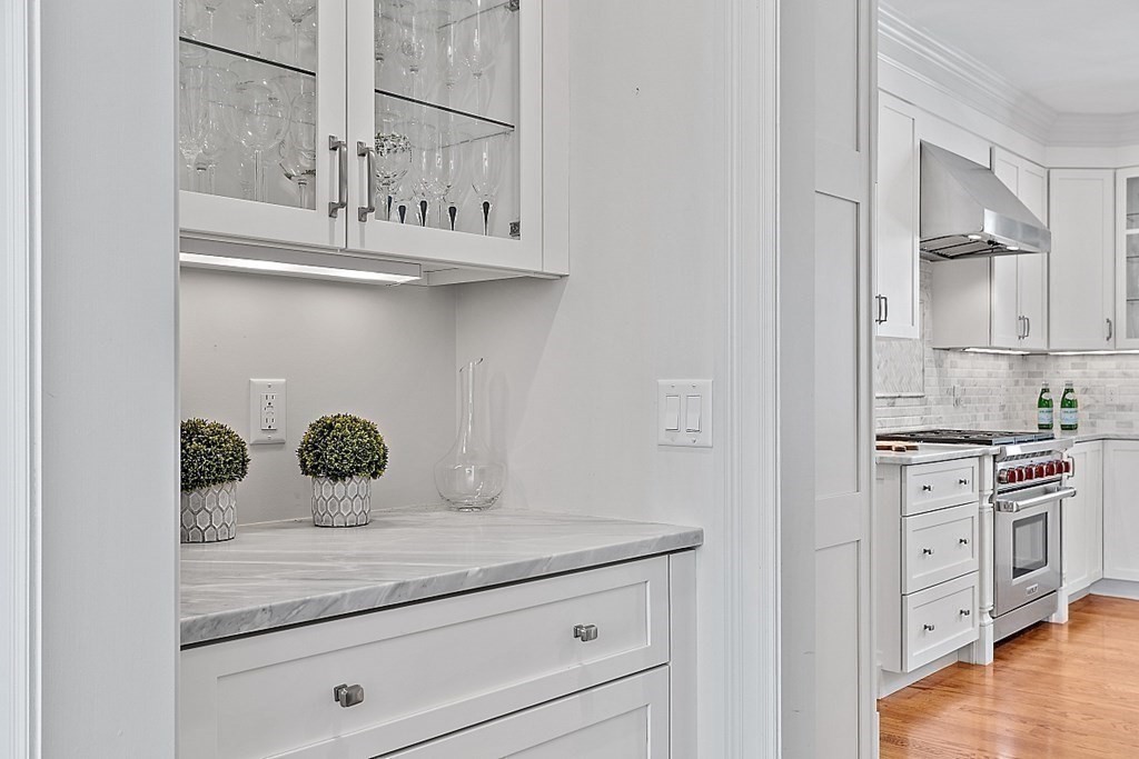 66 Oxbow Road Concord, MA 01742 - Photo 12 of 34 a view of cabinets a sink and a stove in a kitchen