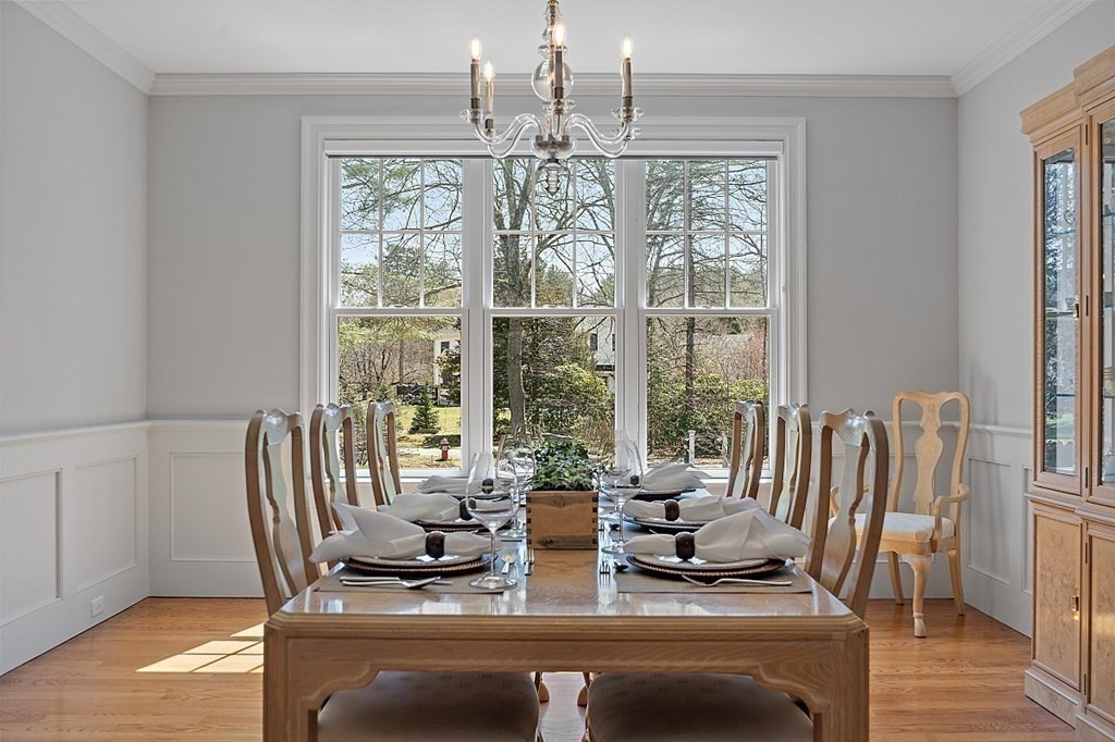 66 Oxbow Road Concord, MA 01742 - Photo 13 of 34 a view of a dining room with furniture wooden floor and chandelier