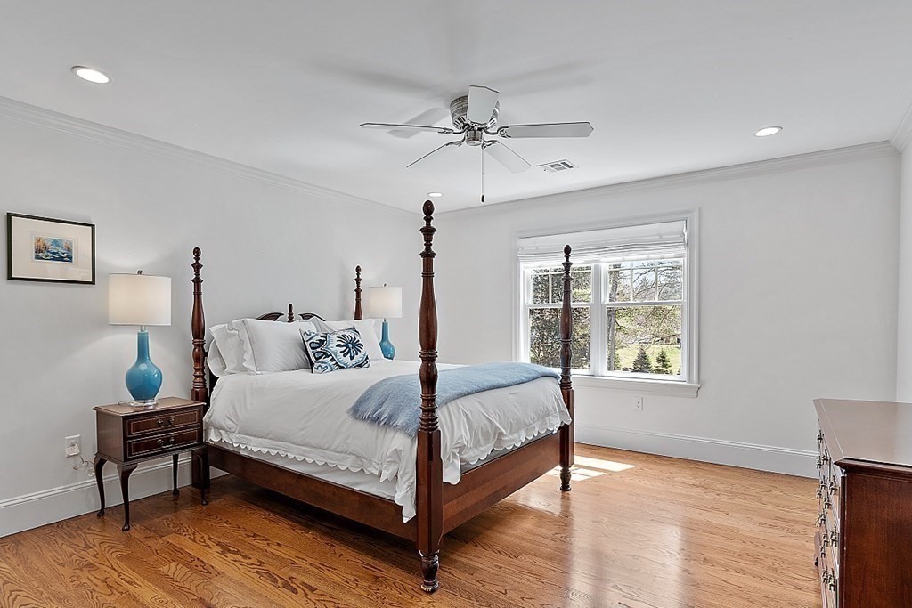 66 Oxbow Road Concord, MA 01742 - Photo 18 of 34 a bedroom with a bed a window and potted plant