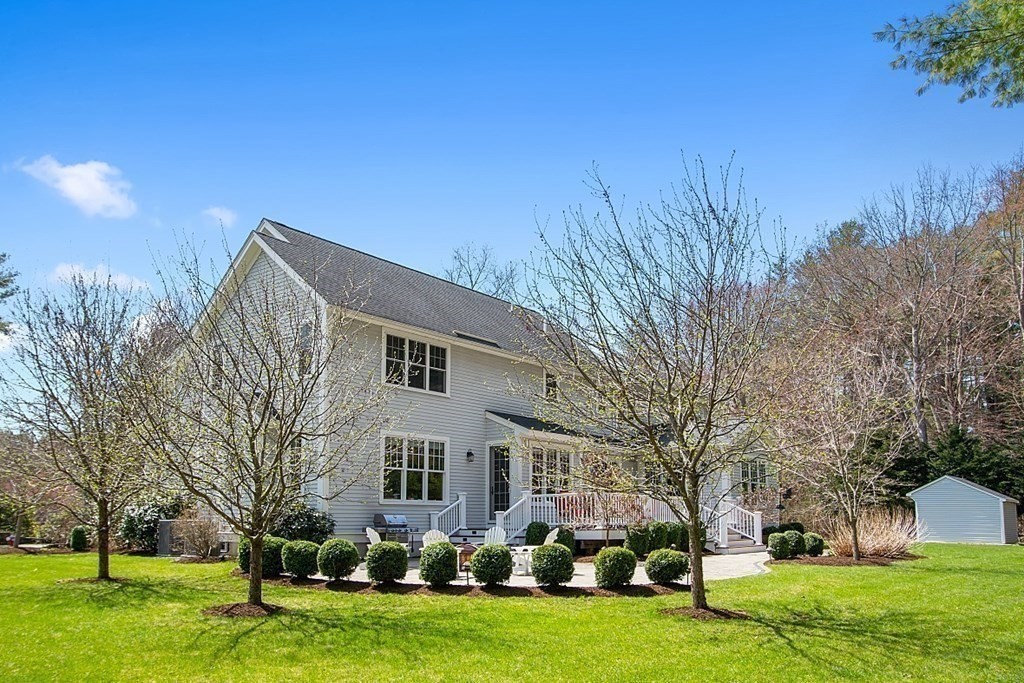 66 Oxbow Road Concord, MA 01742 - Photo 2 of 34 a front view of house with yard and trees