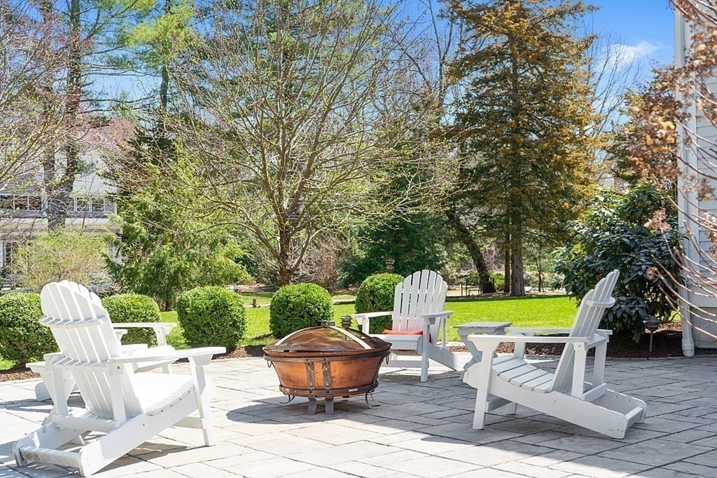 66 Oxbow Road Concord, MA 01742 - Photo 29 of 34 a view of a backyard with plants and chairs