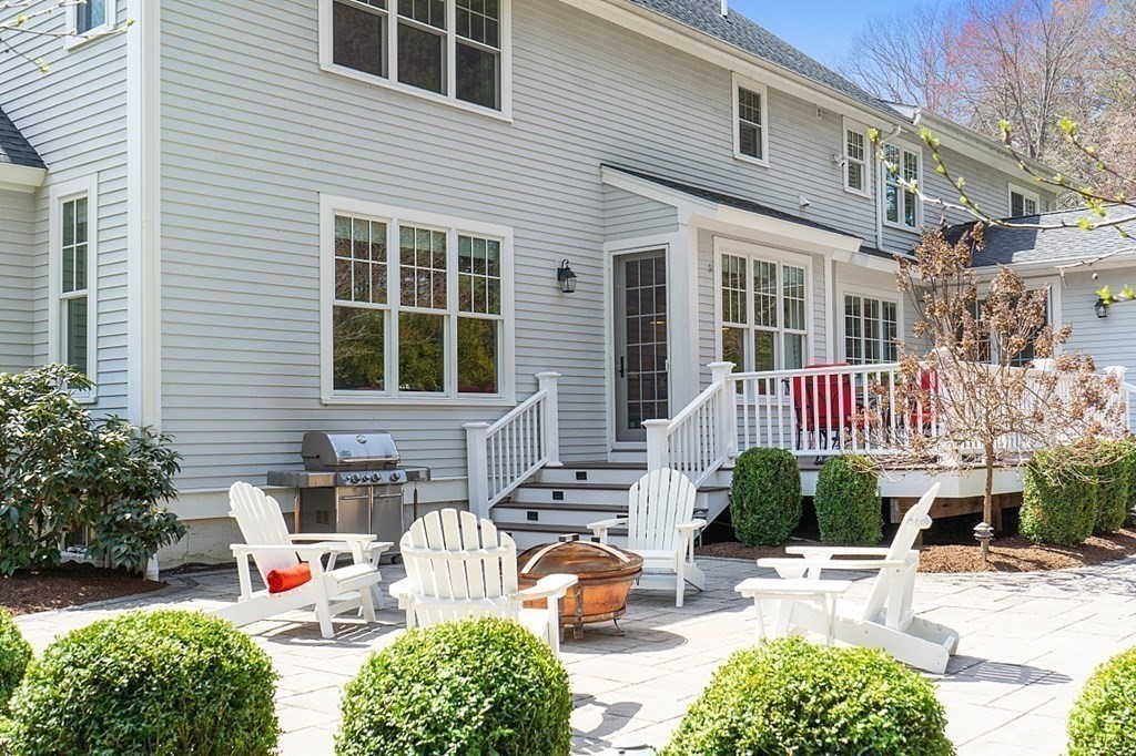 66 Oxbow Road Concord, MA 01742 - Photo 30 of 34 a backyard of a house with outdoor seating space