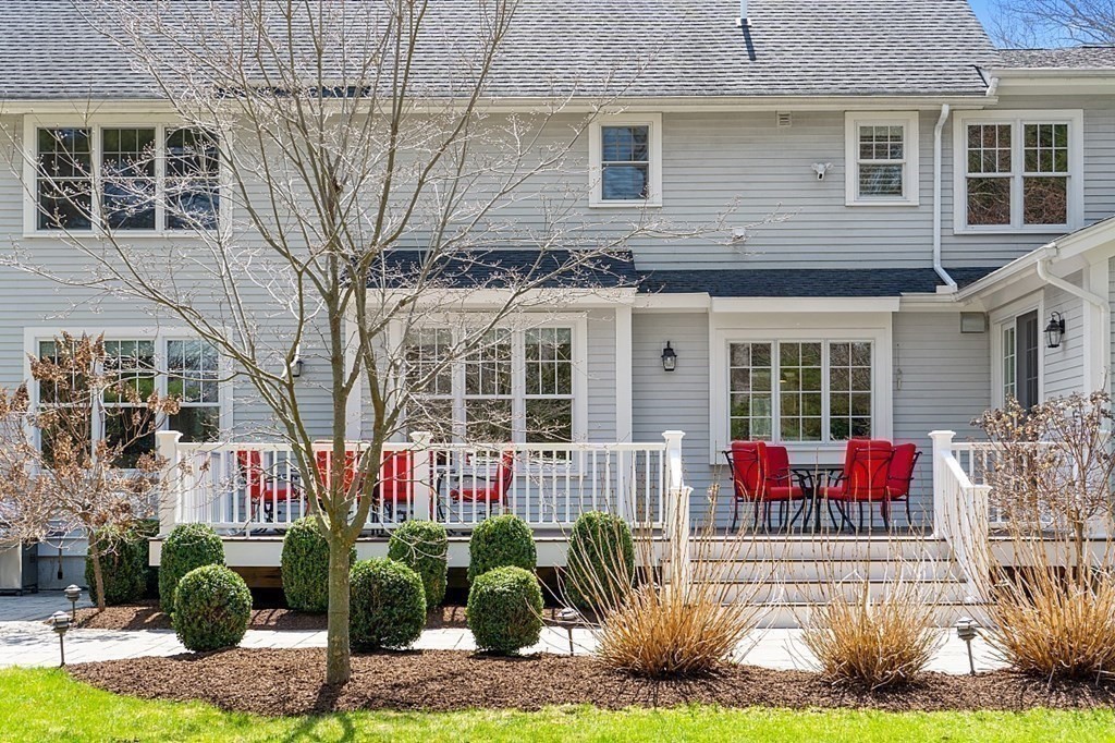 66 Oxbow Road Concord, MA 01742 - Photo 32 of 34 a front view of a house with a garden
