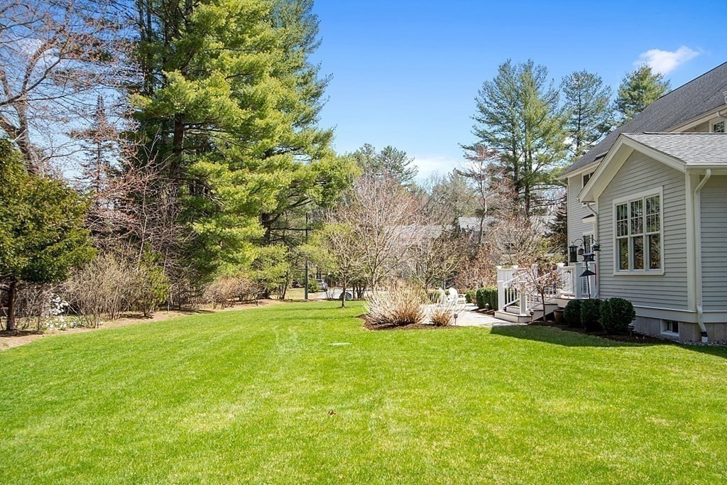 66 Oxbow Road Concord, MA 01742 - Photo 33 of 34 a front view of a house with garden