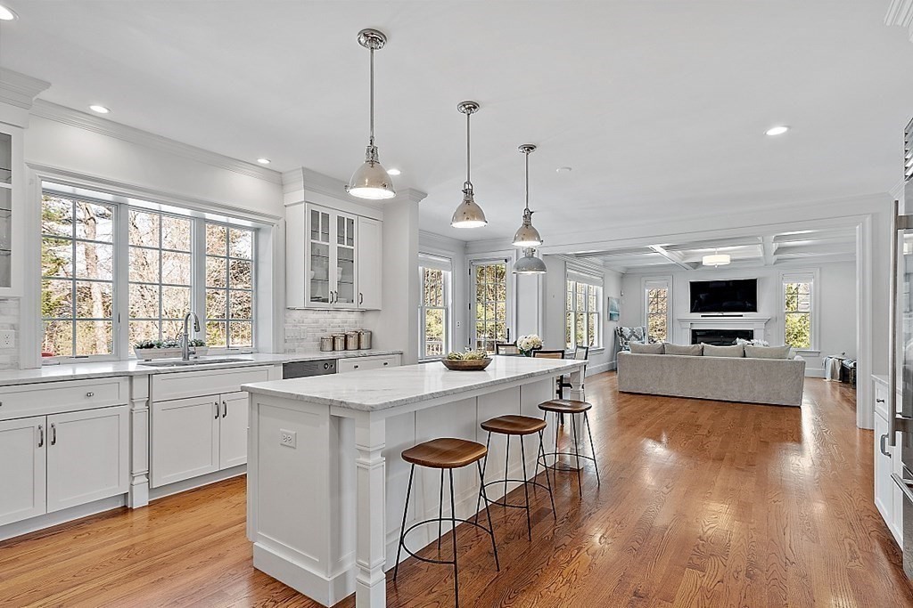 66 Oxbow Road Concord, MA 01742 - Photo 8 of 34 a large kitchen with kitchen island a sink and a stove
