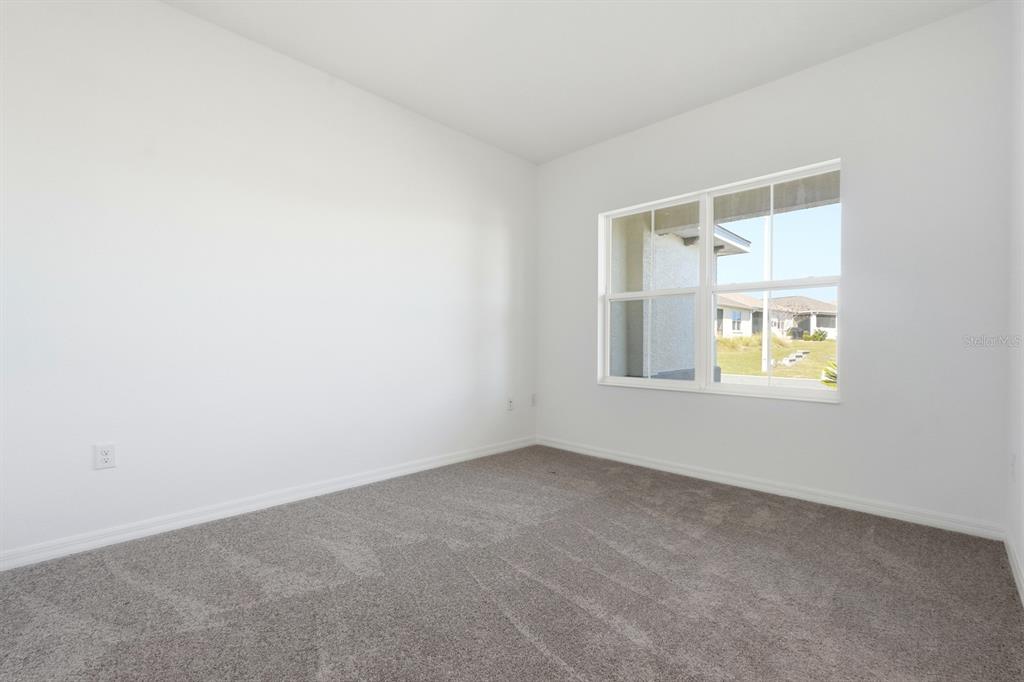 10374 Southwest 96th Street Ocala, FL 34481 - Photo 12 of 29 an empty room with a window