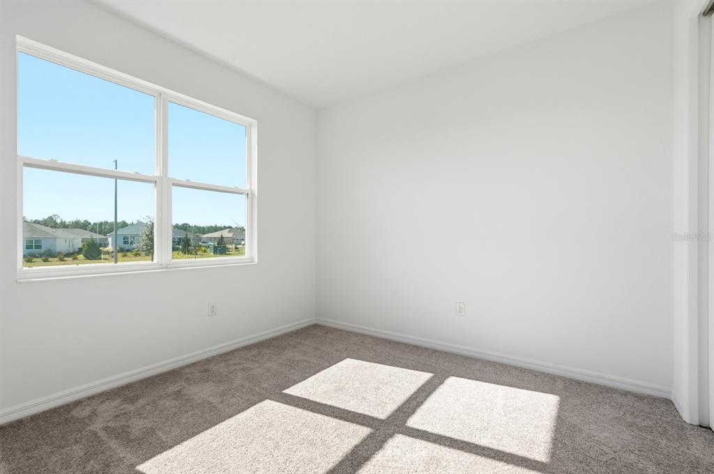 10374 Southwest 96th Street Ocala, FL 34481 - Photo 13 of 29 an empty room with a window