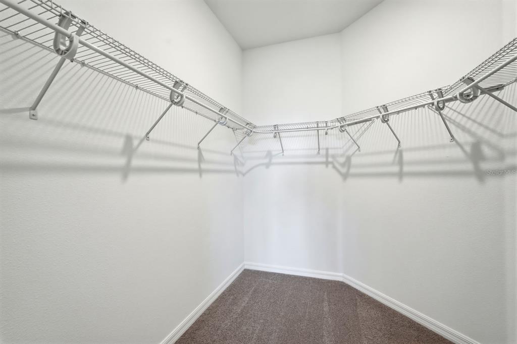 10374 Southwest 96th Street Ocala, FL 34481 - Photo 17 of 29 a view of a room with racks on the wall