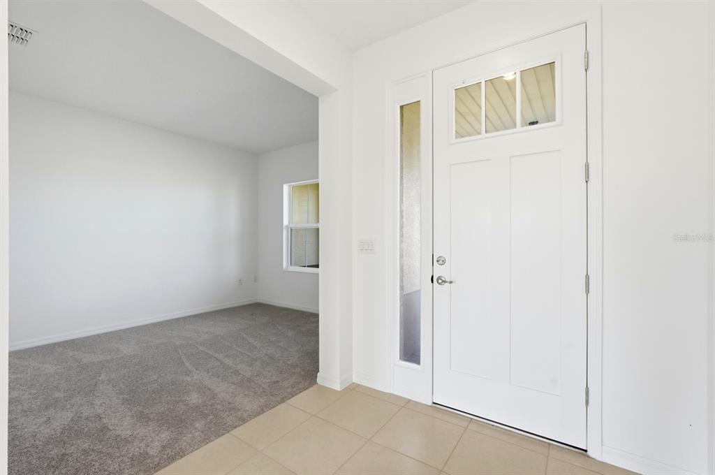 10374 Southwest 96th Street Ocala, FL 34481 - Photo 3 of 29 an empty room with windows