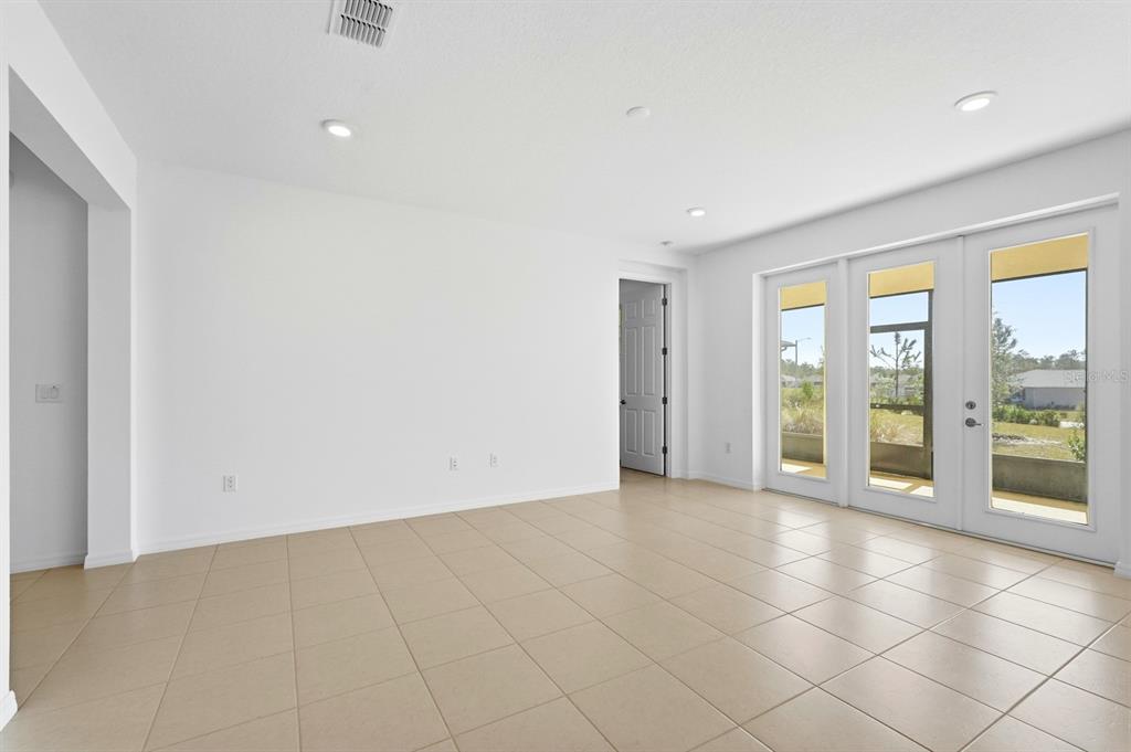 10374 Southwest 96th Street Ocala, FL 34481 - Photo 5 of 29 a view of an empty room with a window