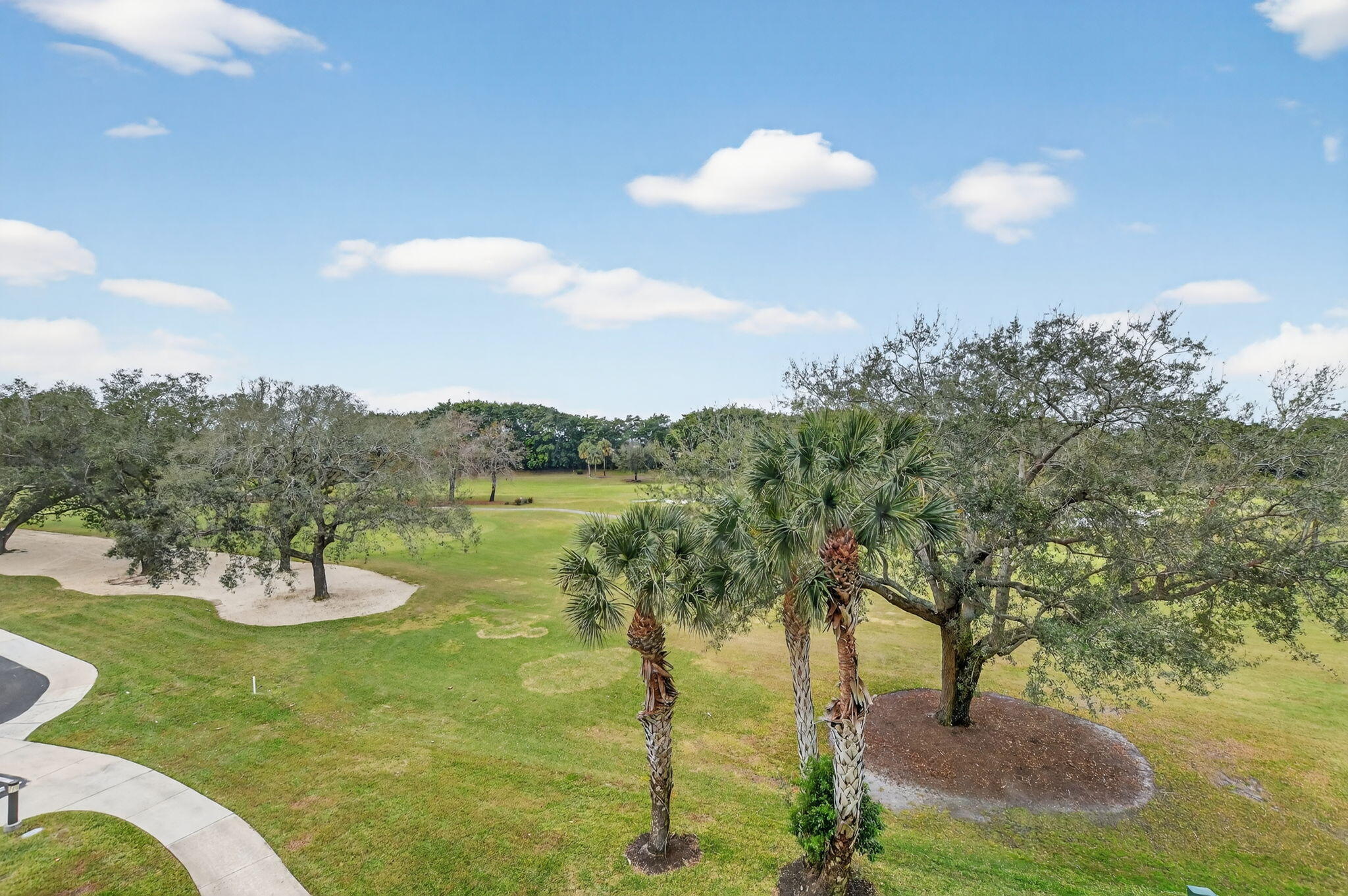 7835 Lakeside Boulevard, Unit 946 Boca Raton, FL 33434 - Photo 20 of 20 a view of a lake with a yard