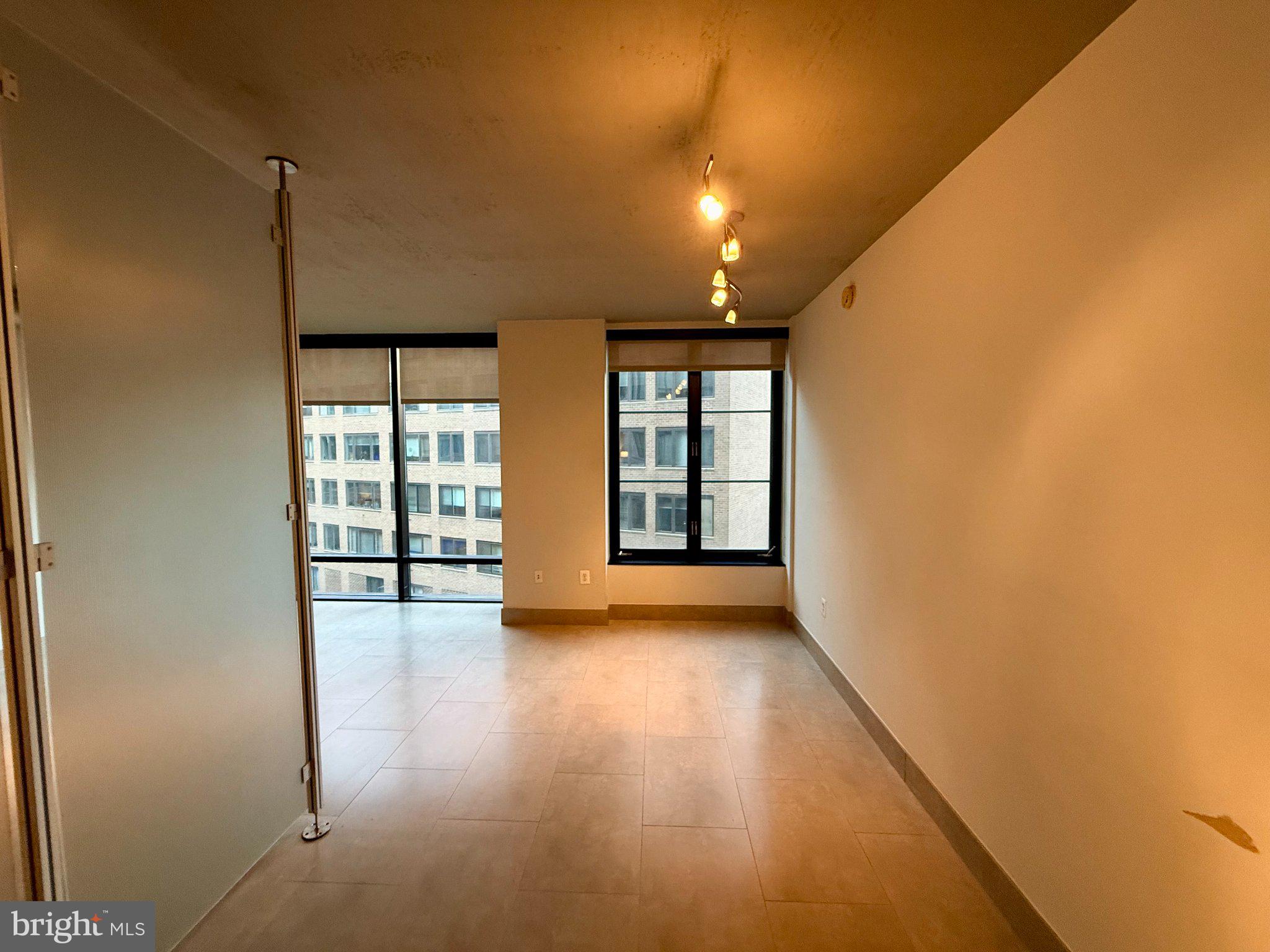1133 14th Street Northwest, Unit 503 Washington, DC 20005 - Photo 10 of 29 Bright, open space with city views.