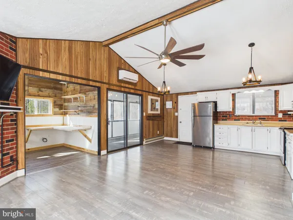 a view of kitchen with cabinets and wooden floor