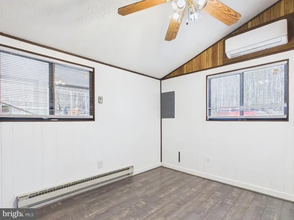 a view of an entryway with wooden floor