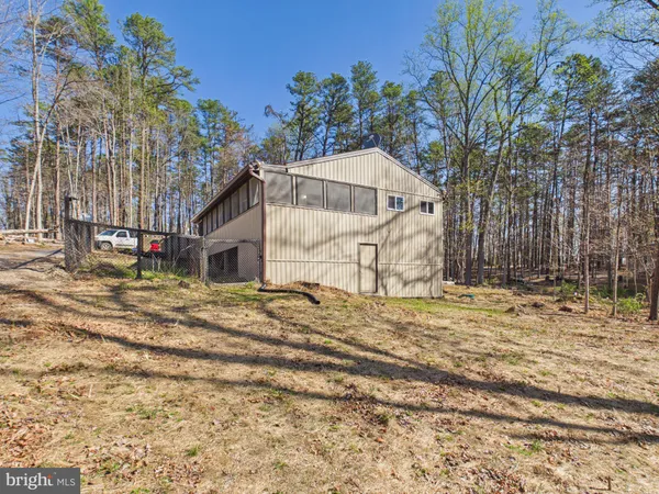 a view of a house with snow on the ground