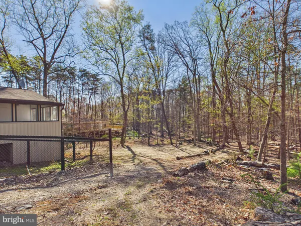 a view of house with trees in the background