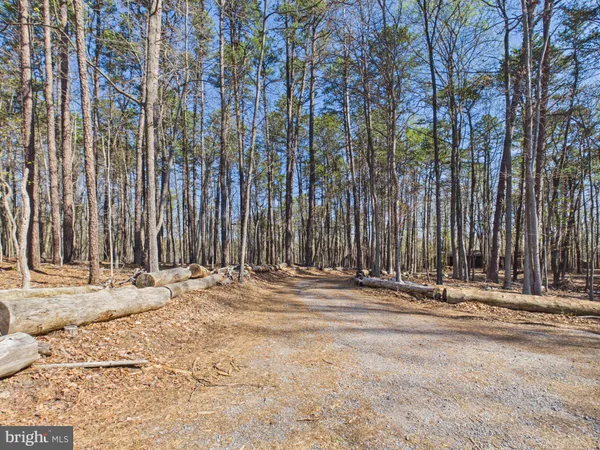 a wooden bench sitting in front of a building