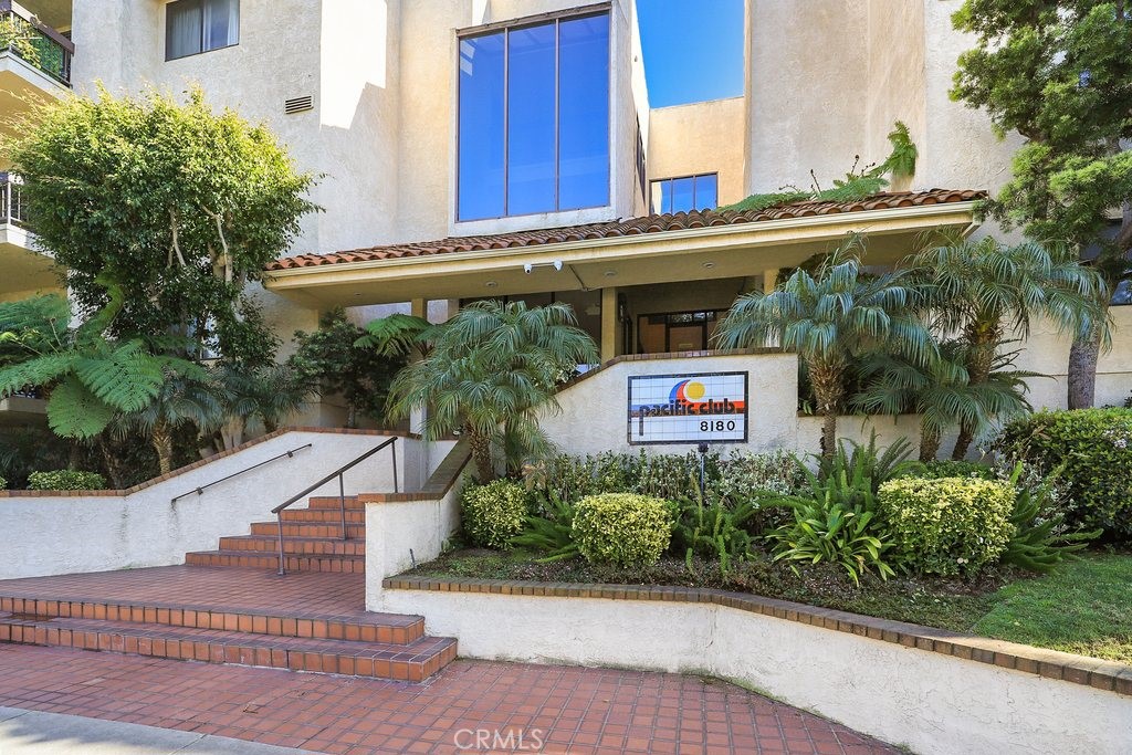 8180 Manitoba Street, Unit 142 Playa del Rey, CA 90293 - Photo 1 of 1 a view of a street with potted plants and a large tree