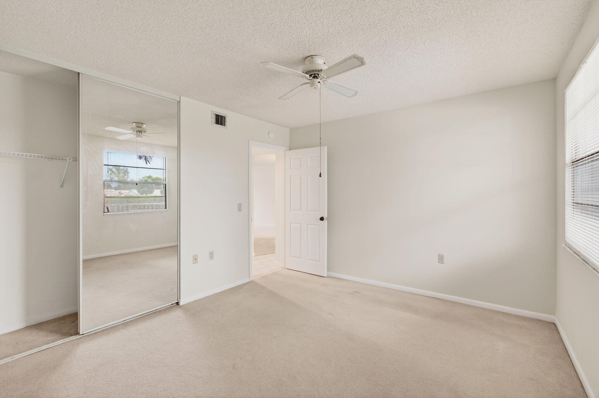 6049 Balboa Circle, Unit 205 Boca Raton, FL 33433 - Photo 14 of 27 wooden floor in an empty room