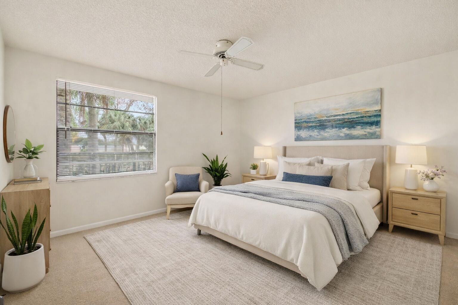 6049 Balboa Circle, Unit 205 Boca Raton, FL 33433 - Photo 16 of 27 a bedroom with a bed potted plant and a window