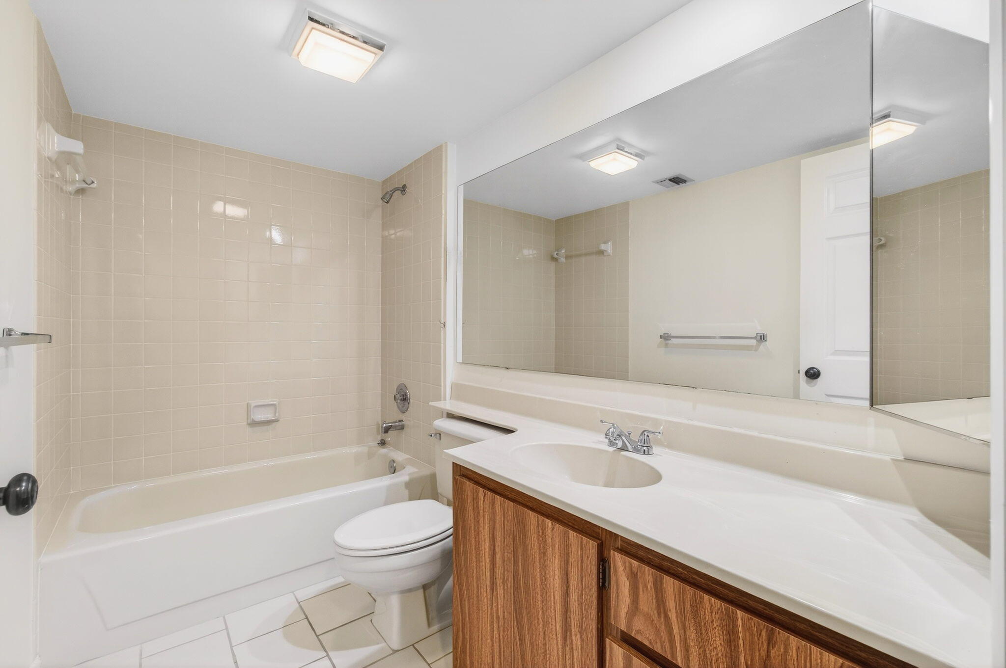 6049 Balboa Circle, Unit 205 Boca Raton, FL 33433 - Photo 17 of 27 a bathroom with a sink a toilet and shower
