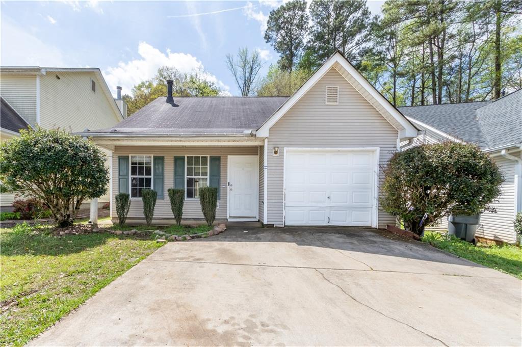 105 Turning Point Stockbridge, GA 30281 - Photo 1 of 1 a view of a house with a yard