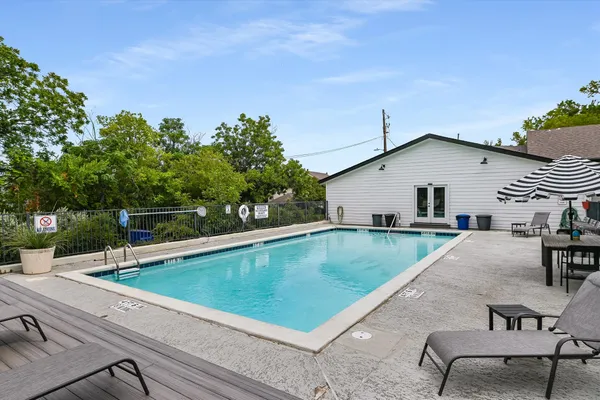 a view of a backyard with a sitting area