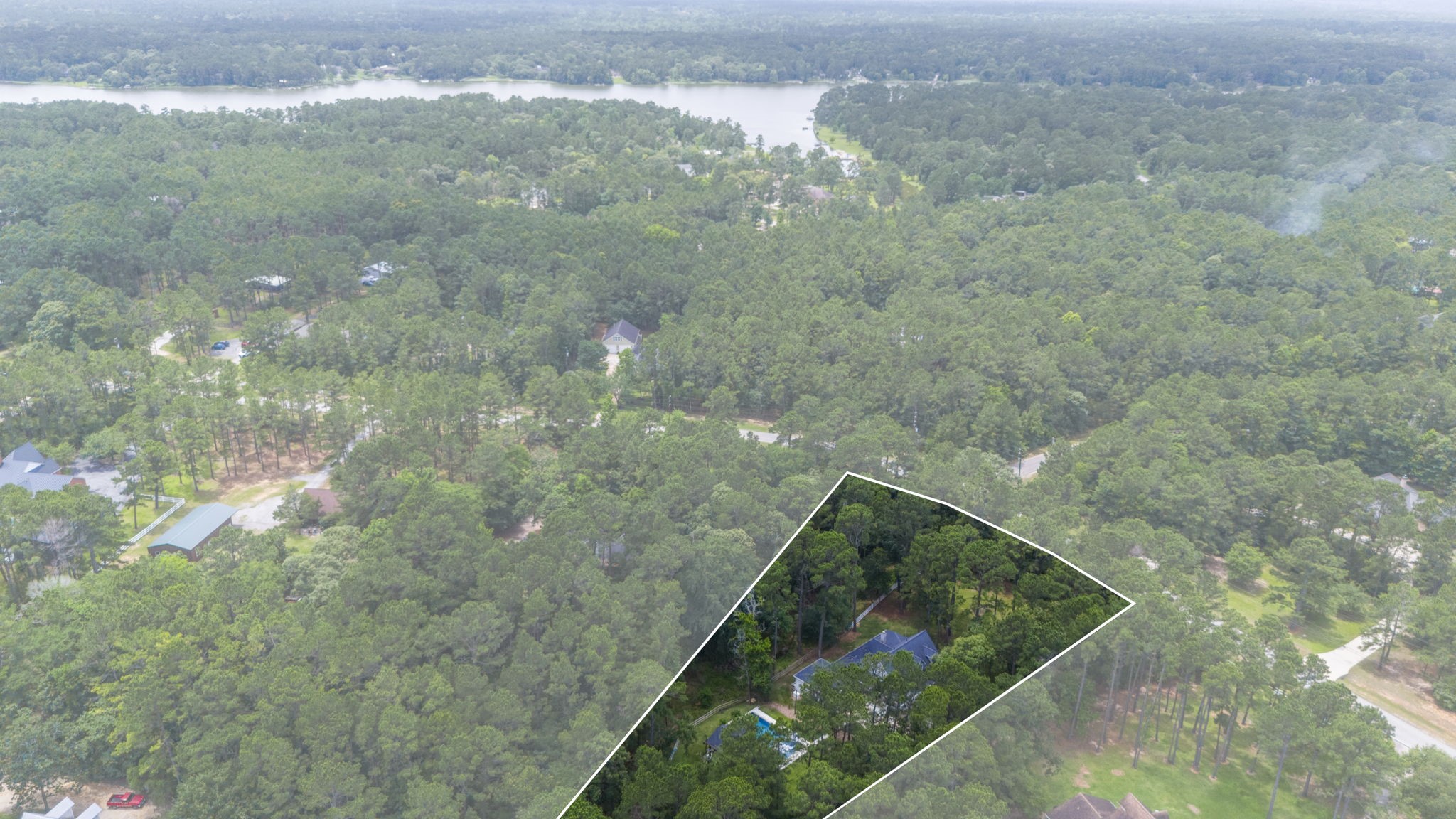 19610 Timber Ridge Drive Magnolia, TX 77355 - Photo 45 of 50 Aerial views highlight the property and its proximity to the 160-acre Indigo Lake. The lake is for residents only and offers fishing, water sports, and a beach park with sand volleyball and a playground.